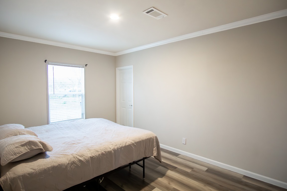 3882 Dry Creek Road Lockhart, TX 78644 - Photo 14 of 18 a bedroom with a bed and a window