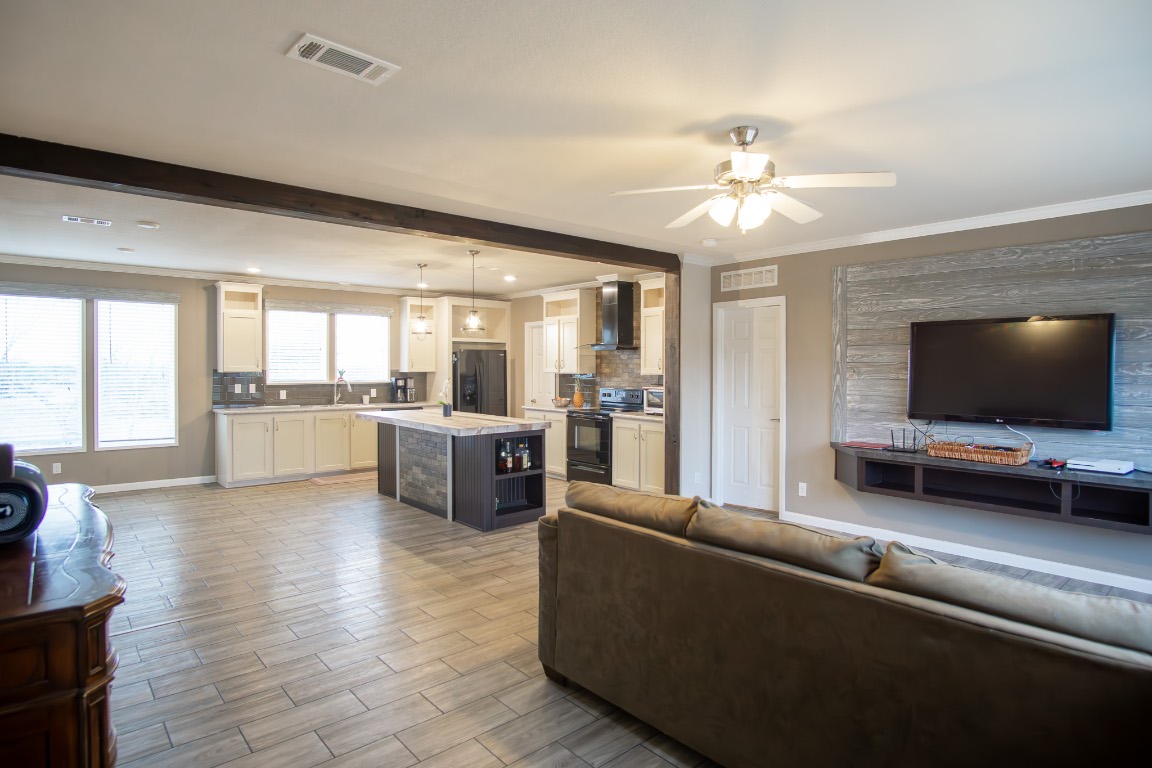 3882 Dry Creek Road Lockhart, TX 78644 - Photo 5 of 18 a living room with furniture and a flat screen tv
