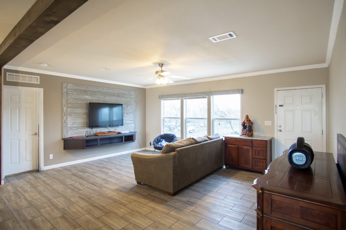 3882 Dry Creek Road Lockhart, TX 78644 - Photo 7 of 18 a living room with furniture and a flat screen tv