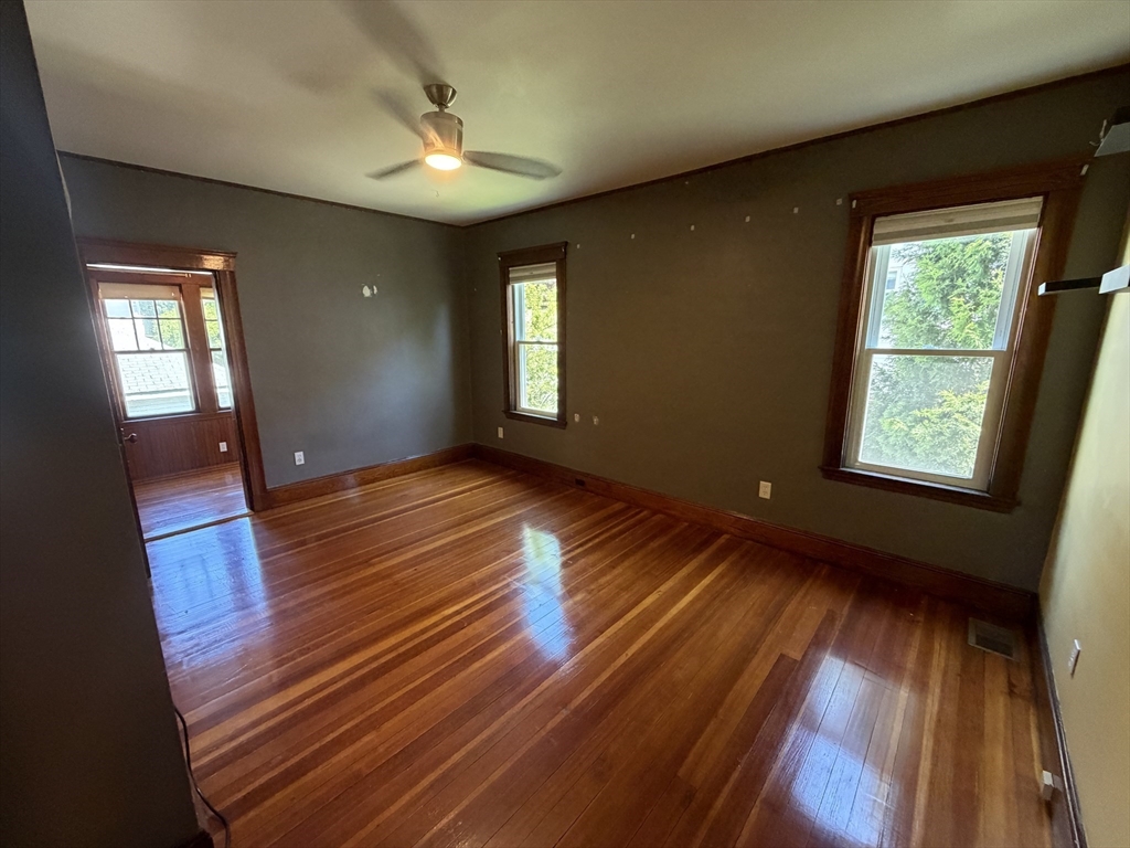 12-14 Warwick Road, Unit 12 Belmont, MA 02478 - Photo 5 of 15 wooden floor in an empty room with a window