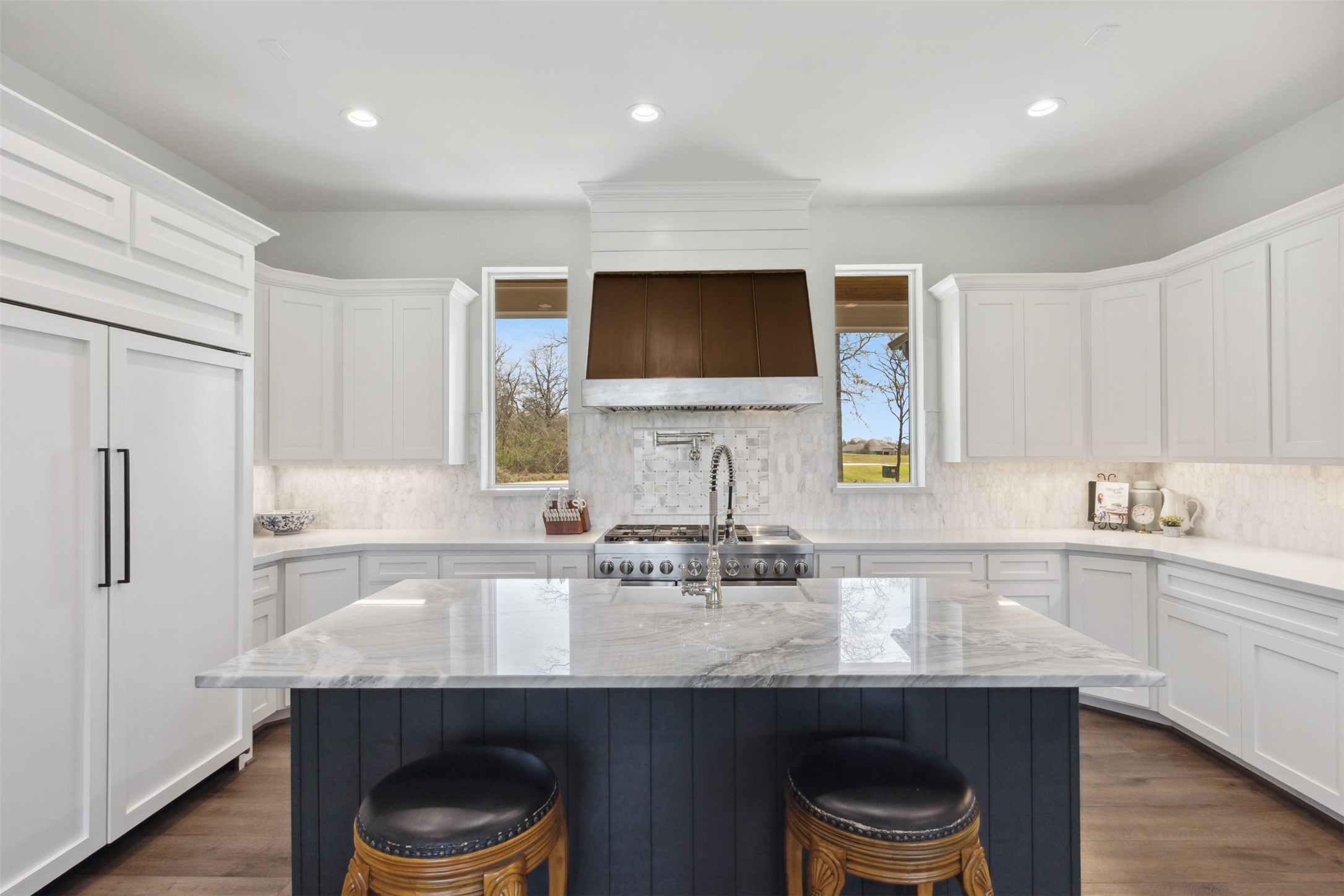 501 Wimberly Circle Hempstead, TX 77445 - Photo 11 of 45 a kitchen with stainless steel appliances granite countertop a sink a refrigerator and a stove