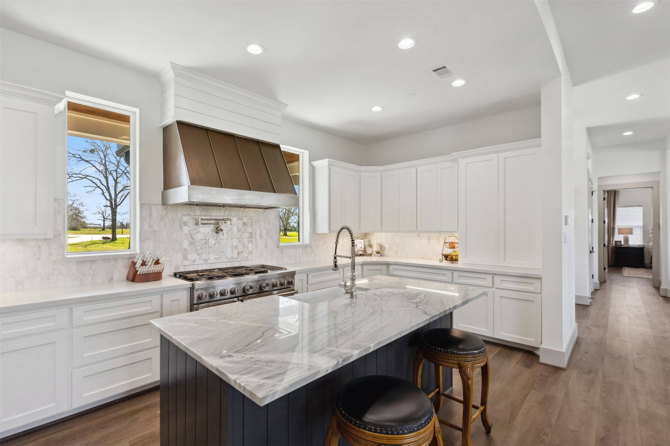 501 Wimberly Circle Hempstead, TX 77445 - Photo 12 of 45 a kitchen with a sink cabinets and wooden floor