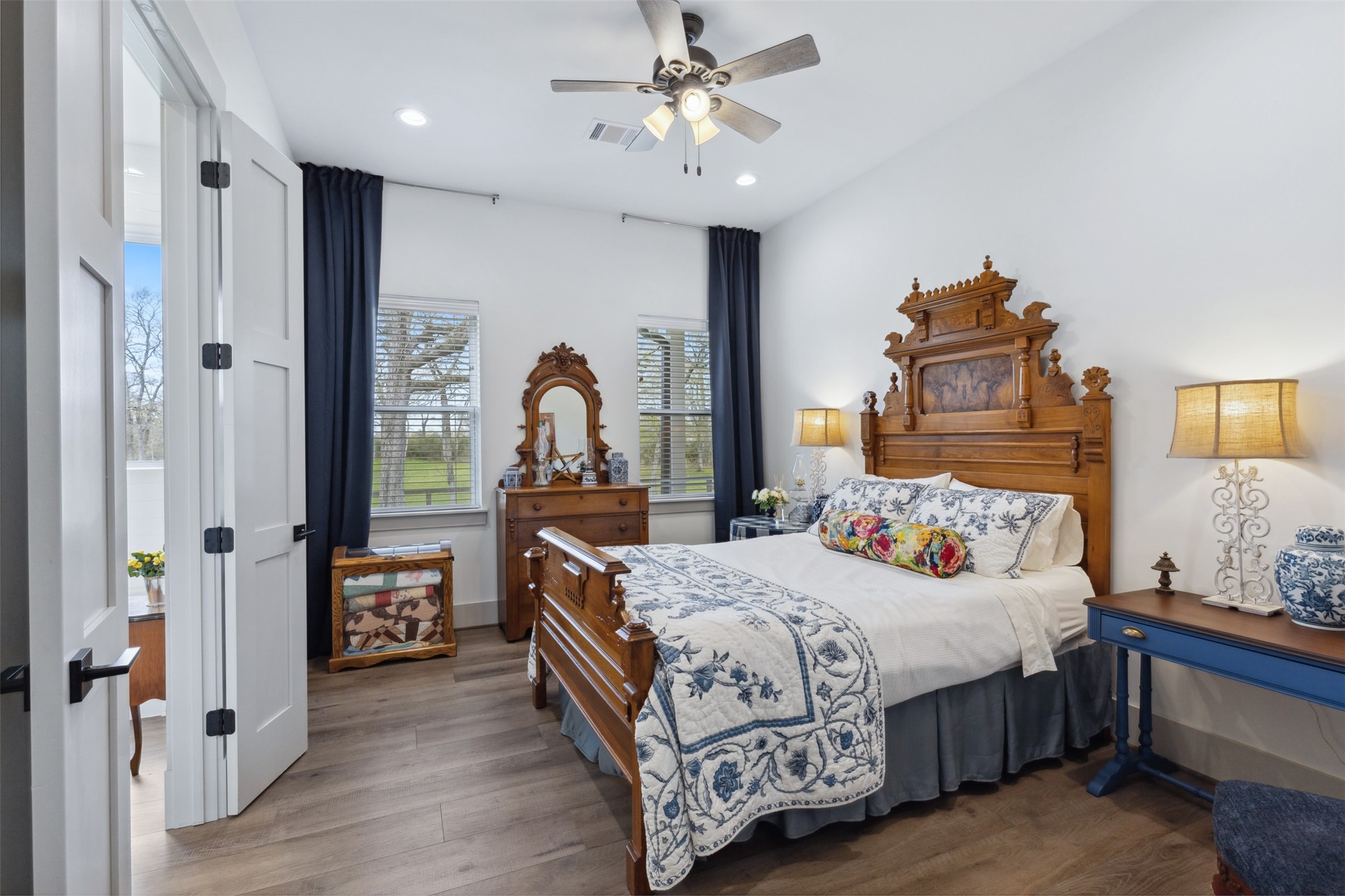 501 Wimberly Circle Hempstead, TX 77445 - Photo 26 of 45 a bedroom with a bed and a chandelier