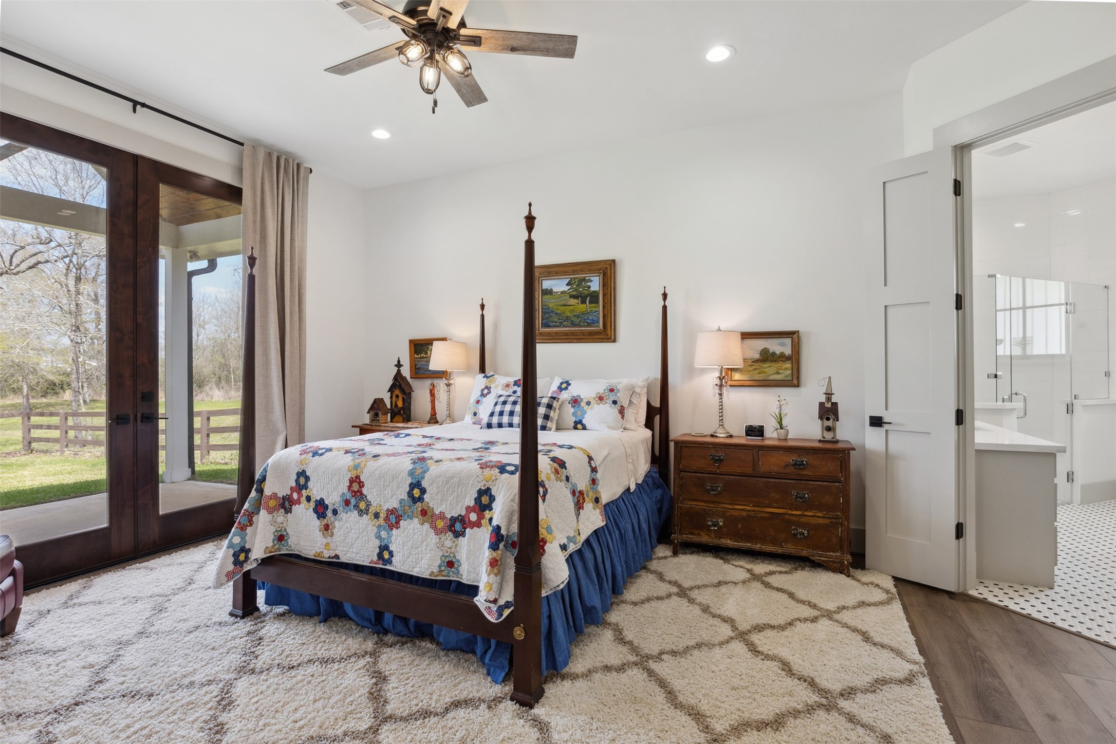 501 Wimberly Circle Hempstead, TX 77445 - Photo 29 of 45 a bedroom with a bed and a chandelier