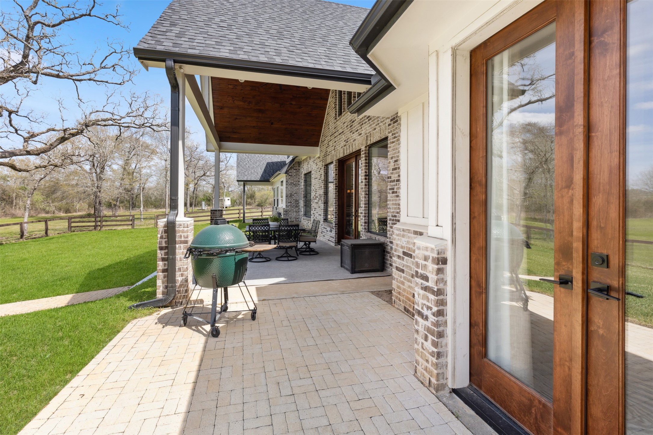 501 Wimberly Circle Hempstead, TX 77445 - Photo 42 of 45 a view of patio with a table chairs and a yard