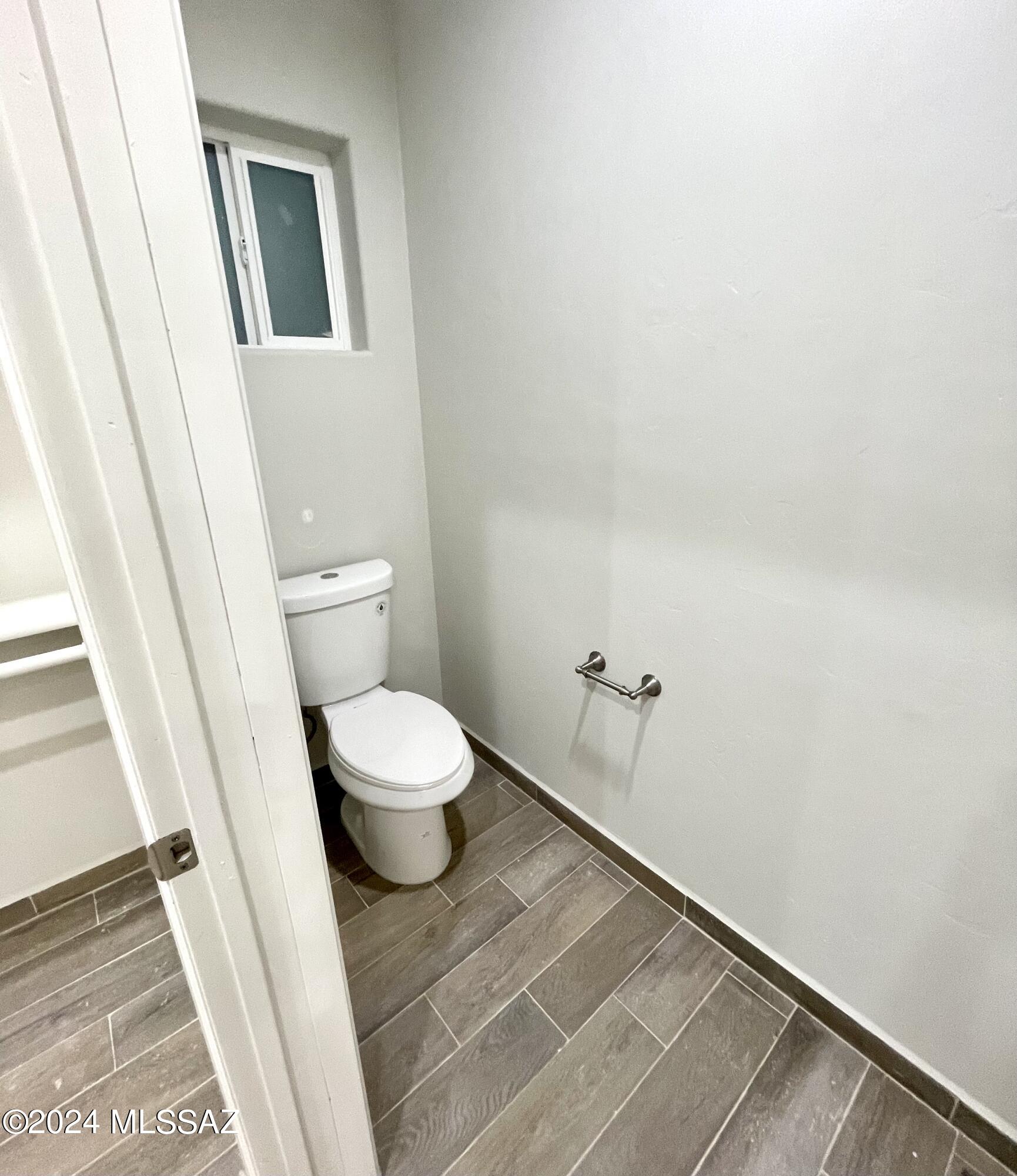 1049 Camino Estrella Rio Rico, AZ 85648 - Photo 19 of 28 a bathroom with a toilet and a shower