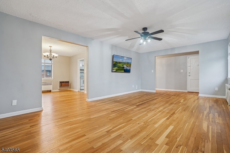 23 Troy Drive, Unit B Springfield, NJ 07081 - Photo 7 of 22 a view of empty room with wooden floor and fan