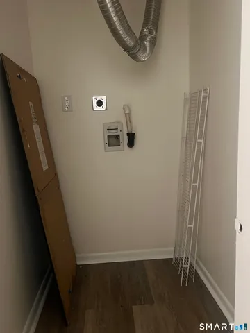 a view of room with wooden floor