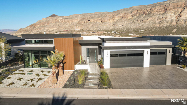 3607 South Cypress Pt Road Hurricane, UT 84737 - Photo 4 of 59 Contemporary house with a mountain view, driveway, and an attached garage
