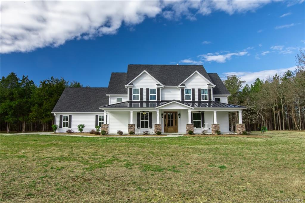 283 Currence Road Clover, SC 29710 - Photo 1 of 35 a front view of a house with a garden
