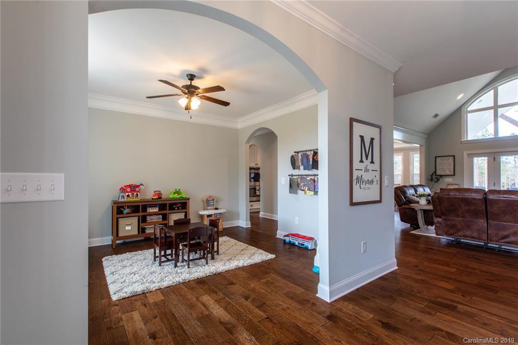 283 Currence Road Clover, SC 29710 - Photo 14 of 35 a view of a dining room with furniture and wooden floor