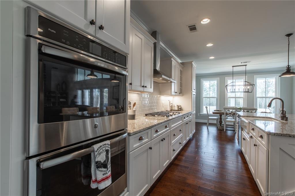 283 Currence Road Clover, SC 29710 - Photo 23 of 35 a kitchen with stainless steel appliances and white cabinets