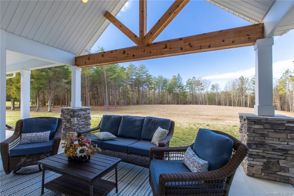283 Currence Road Clover, SC 29710 - Photo 8 of 35 a outdoor living space with furniture and garden view