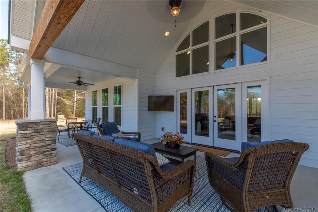 283 Currence Road Clover, SC 29710 - Photo 10 of 35 a outdoor living space with patio furniture and glass windows