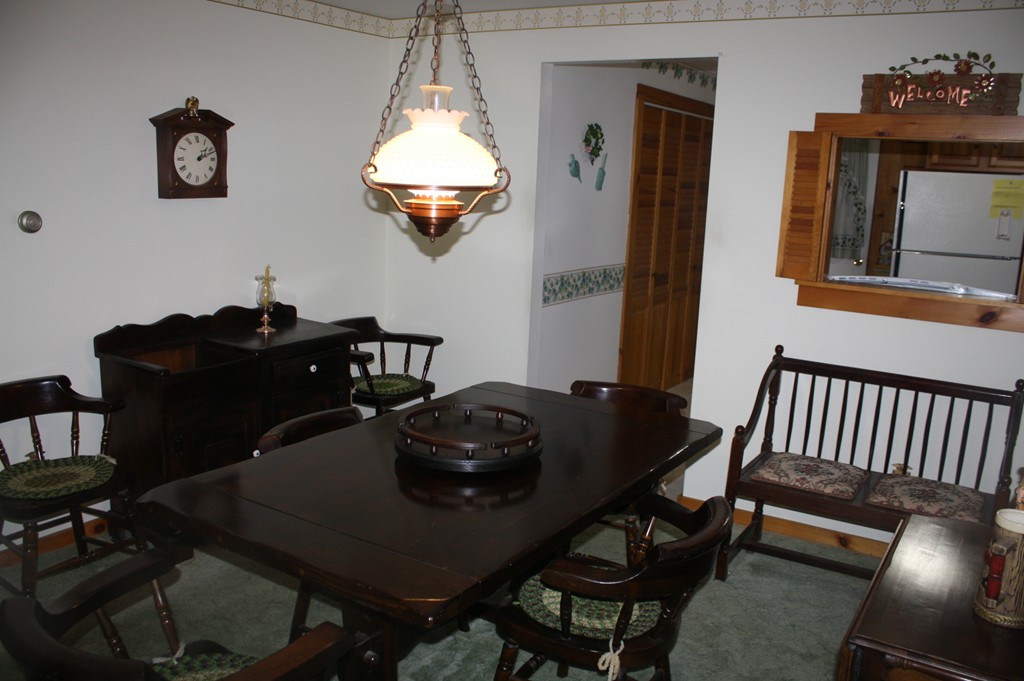 14 Brittingham Hill Road Rowe, MA 01367 - Photo 4 of 9 a dining room with a table and chairs