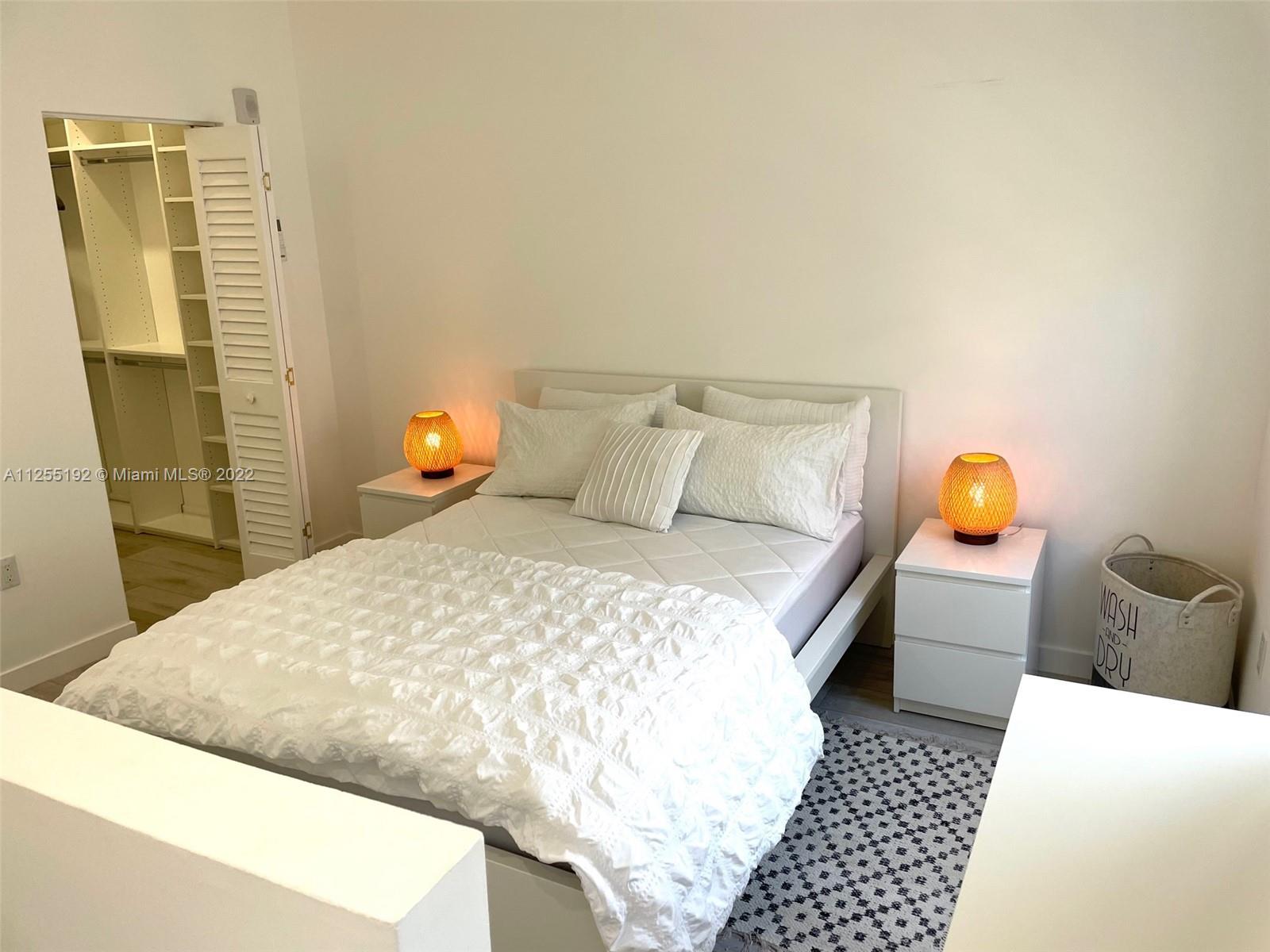 1610 Euclid Avenue, Unit A110 Miami Beach, FL 33139 - Photo 11 of 19 a bedroom with a bed and dresser