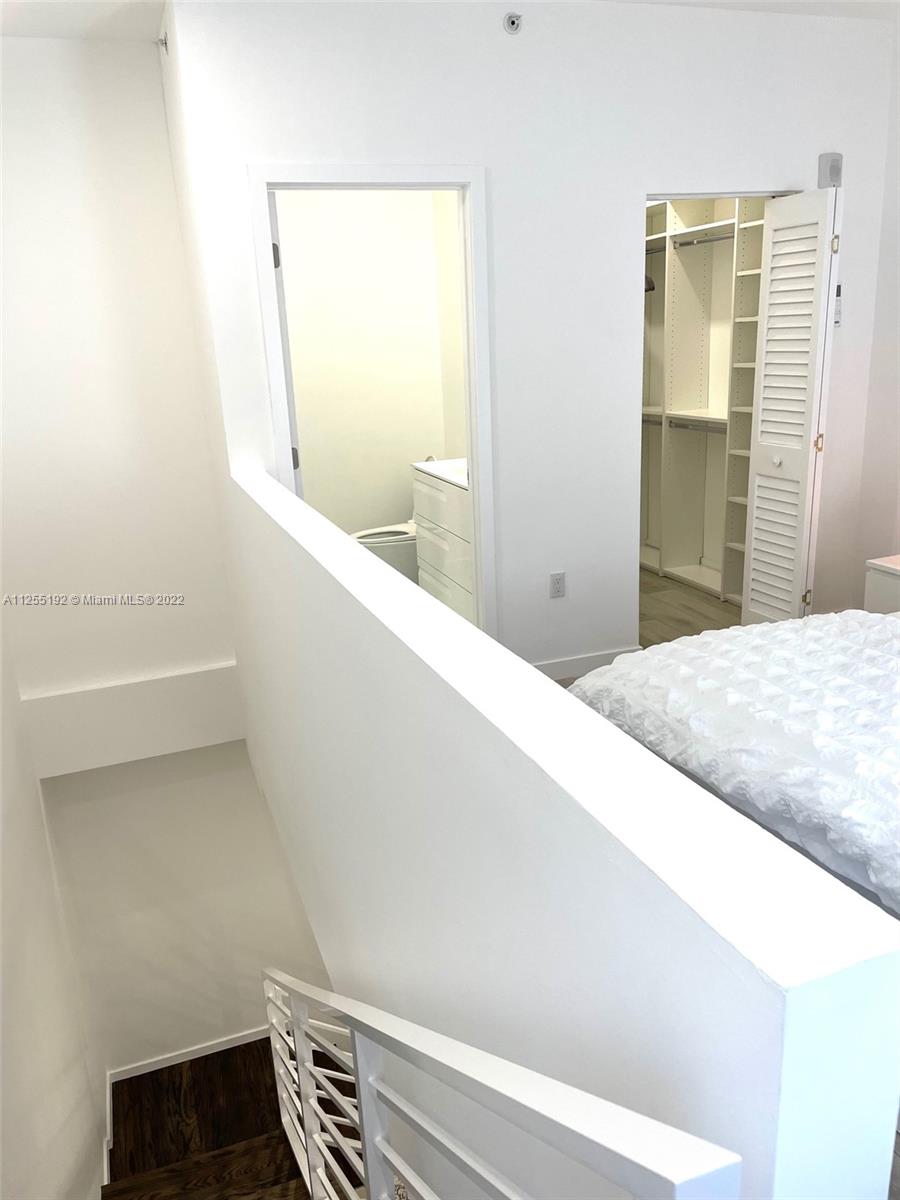 1610 Euclid Avenue, Unit A110 Miami Beach, FL 33139 - Photo 13 of 19 a view of hallway with wooden floor