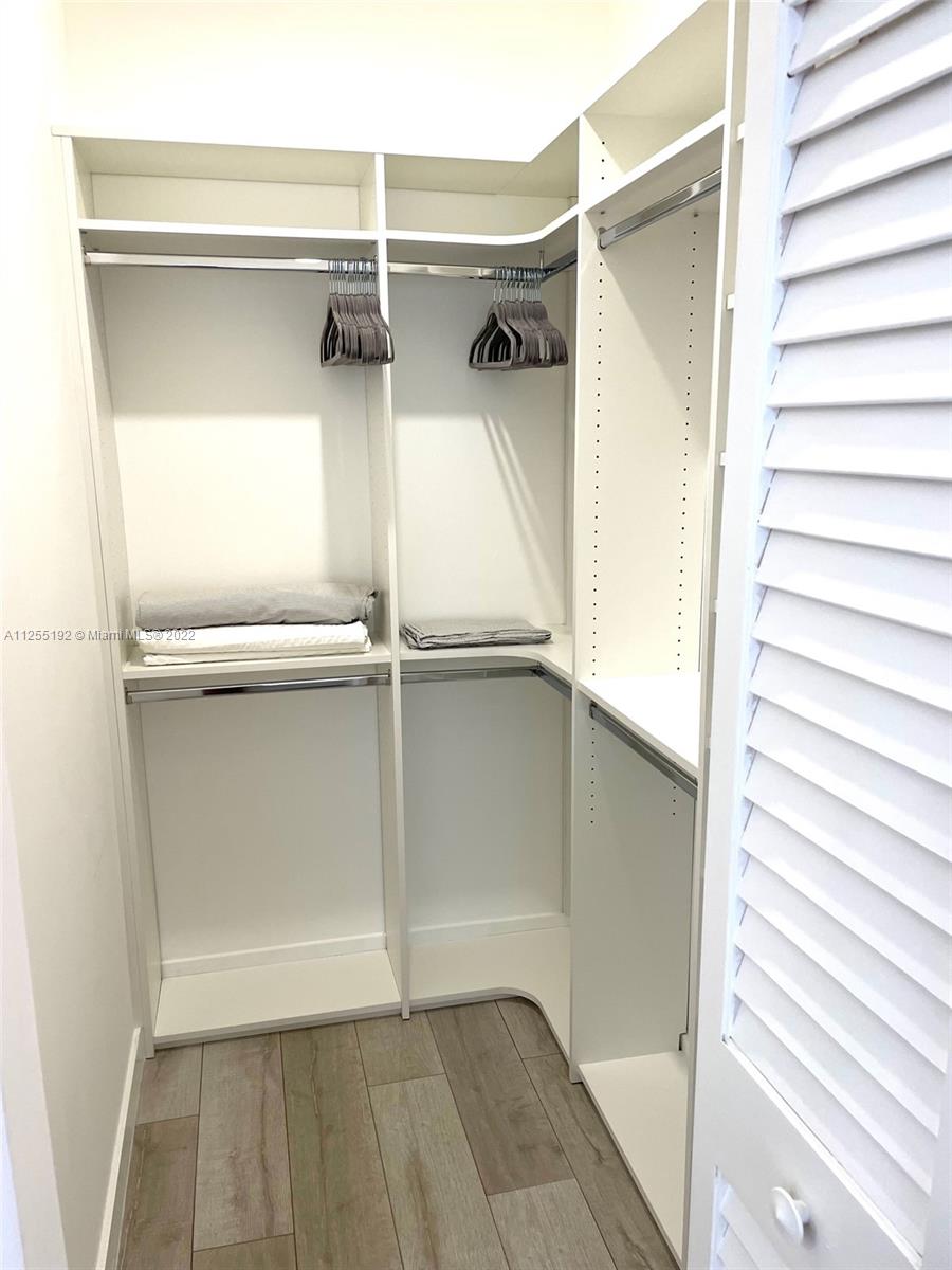 1610 Euclid Avenue, Unit A110 Miami Beach, FL 33139 - Photo 14 of 19 a view of closet area with empty racks
