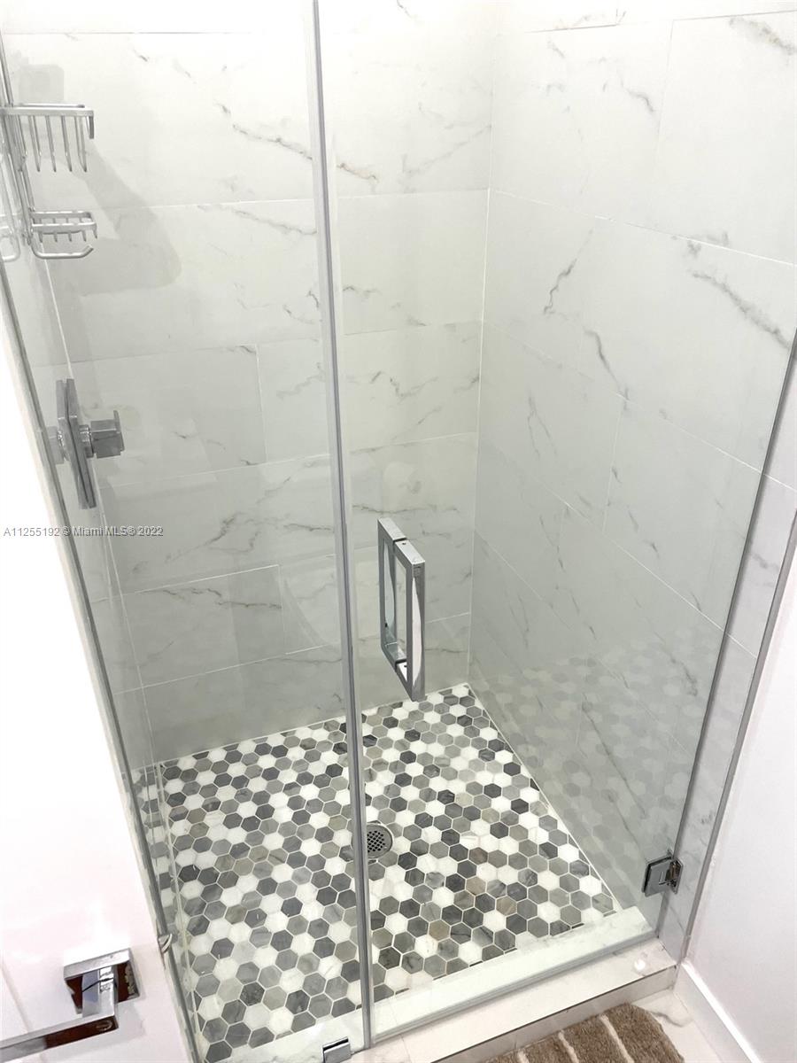 1610 Euclid Avenue, Unit A110 Miami Beach, FL 33139 - Photo 17 of 19 a bathroom with a shower