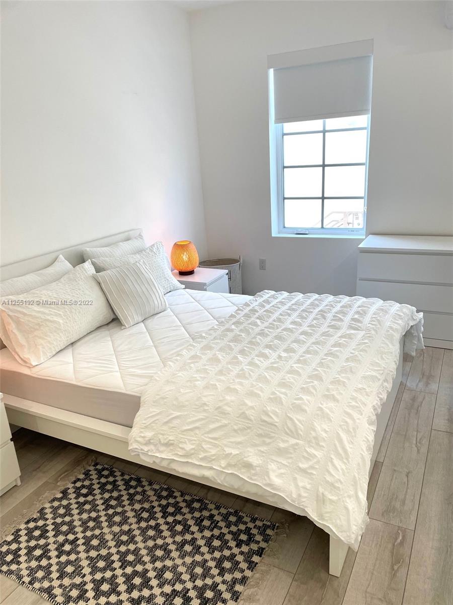1610 Euclid Avenue, Unit A110 Miami Beach, FL 33139 - Photo 18 of 19 a bedroom with a bed and a window