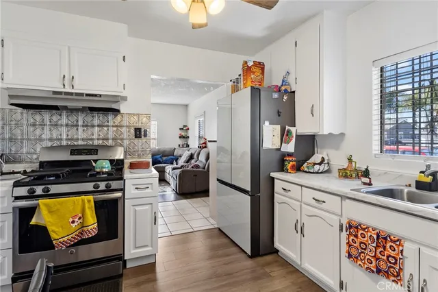 a bathroom with a toilet and a shower curtain