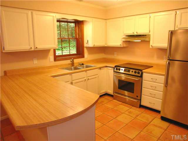 1309 Onslow Road Raleigh, NC 27606 - Photo 3 of 11 Kitchen work area has stylish quarry tile floor, recent appliances