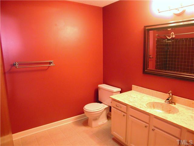 1309 Onslow Road Raleigh, NC 27606 - Photo 5 of 11 Roomy hall bath has updated lighting and faucette, plus a designer's touch with it's "Raleigh red" walls