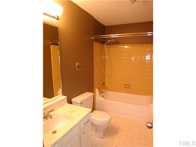 1309 Onslow Road Raleigh, NC 27606 - Photo 6 of 11 Master bath has updated lighting, faucette and a tub/shower combination (instead of the more typical cramped, stand-up shower)