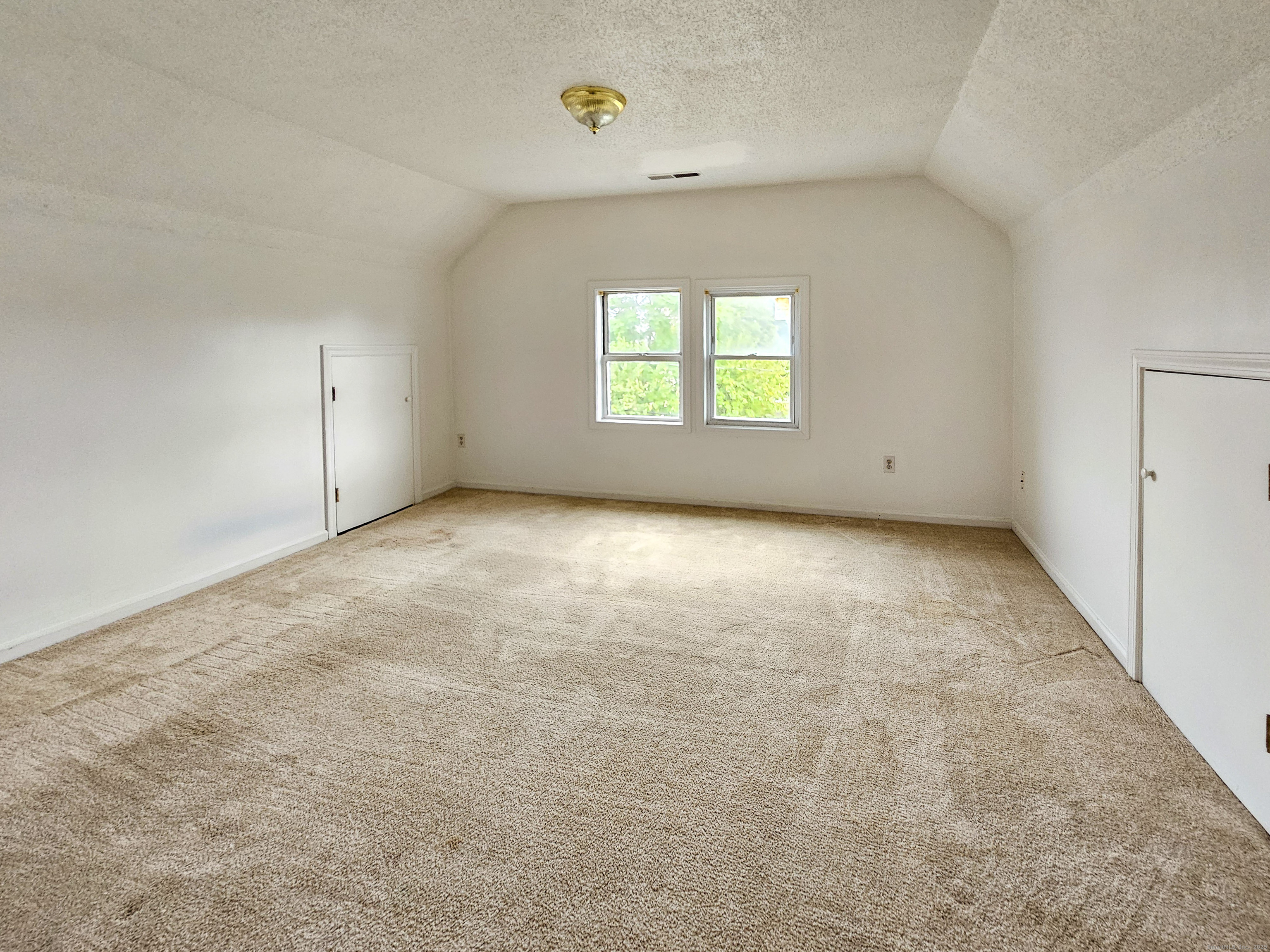 54 Washington Street, Unit 3 Wallingford, CT 06492 - Photo 5 of 9 an empty room with windows
