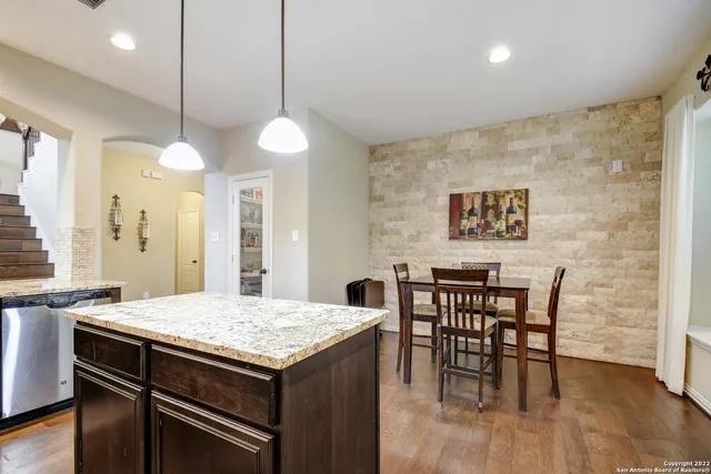 a kitchen with a table and chairs in it