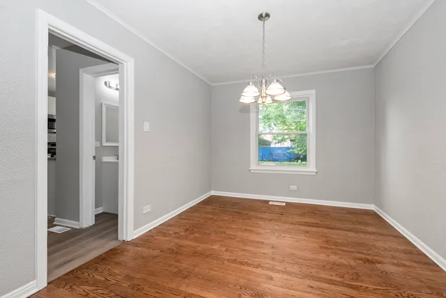 an empty room that has a window in it