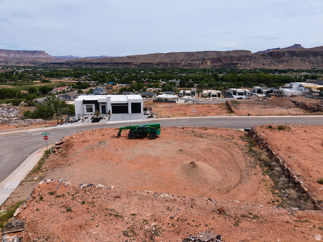 1373 725 South Hurricane, UT 84737 - Photo 7 of 7 Expansive undeveloped lot featuring red earth terrain, a mound of sand, and a partial retaining wall