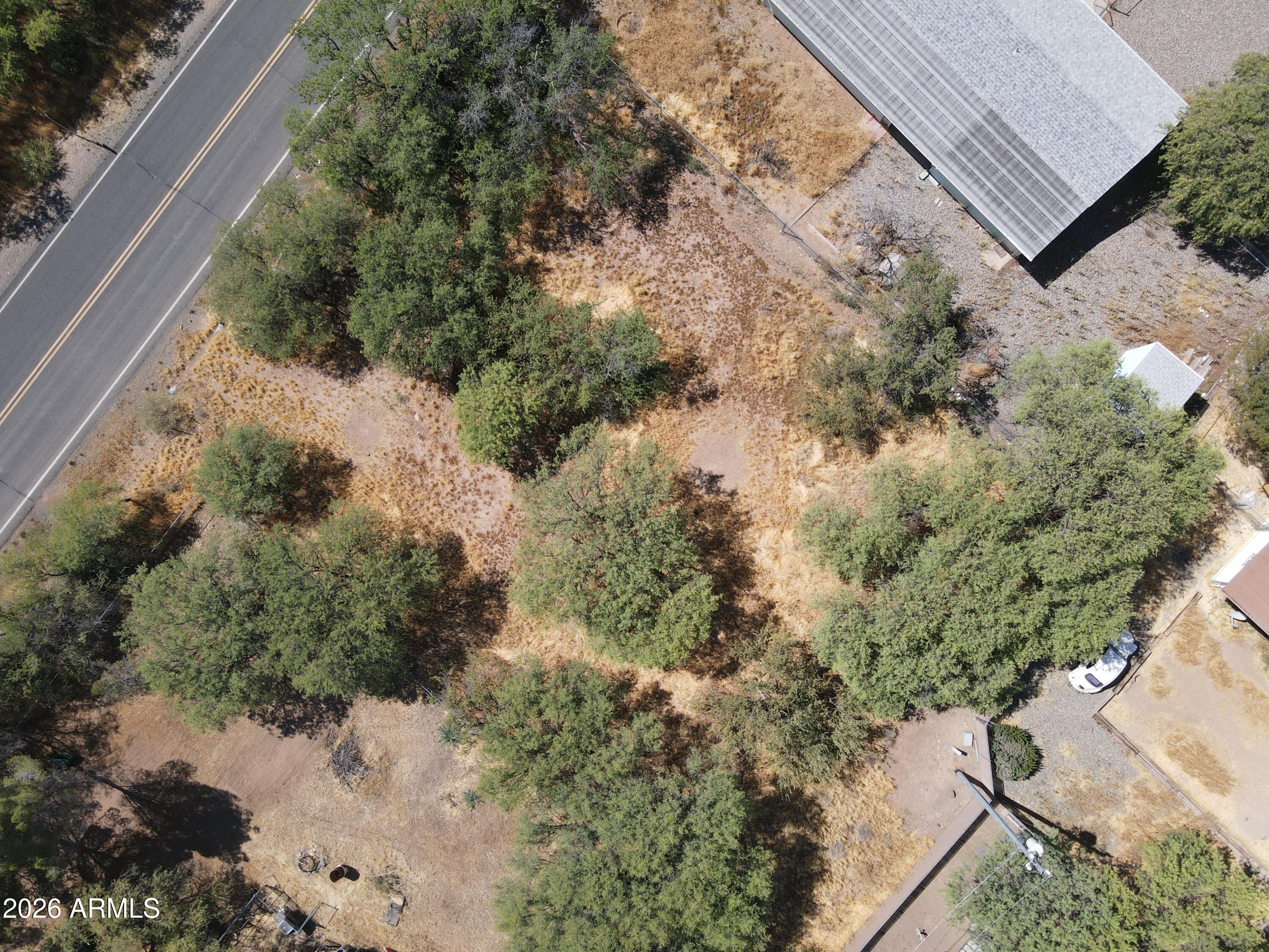3665 South Salt Mine Road, Unit 27 Camp Verde, AZ 86322 - Photo 13 of 15 a view of a yard with plants and large trees