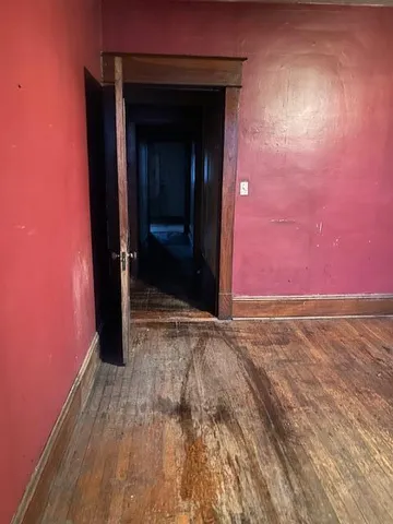 wooden floor and window in an empty room