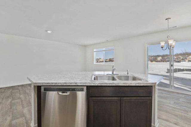 18 West Lake Court Cary, IL 60013 - Photo 11 of 21 a bathroom with a granite countertop sink a mirror and vanity