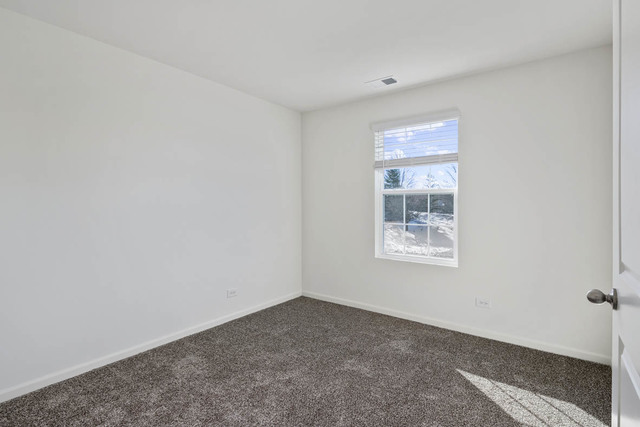 18 West Lake Court Cary, IL 60013 - Photo 14 of 21 a view of an empty room with a window