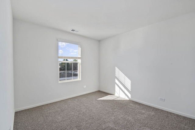 18 West Lake Court Cary, IL 60013 - Photo 15 of 21 an empty room with windows