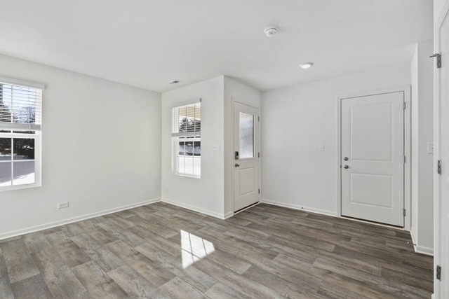 18 West Lake Court Cary, IL 60013 - Photo 5 of 21 a view of empty room with wooden floor