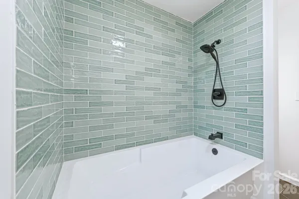 a bathroom with a bath tub