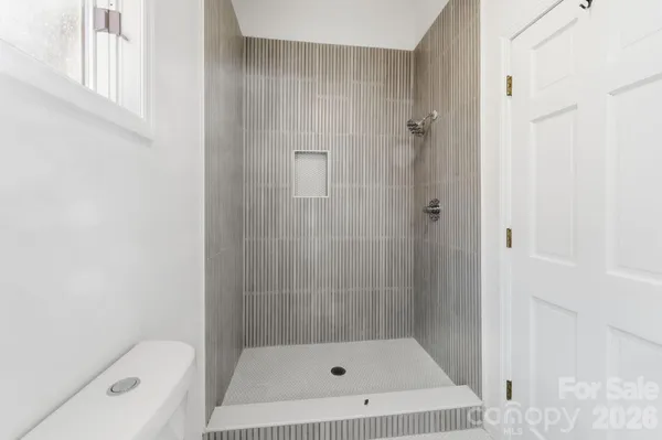 a bathroom with a shower and bathtub