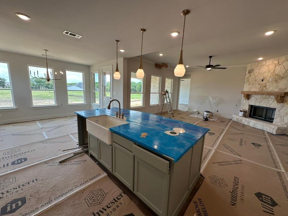 605 Brown Road Leonard, TX 75452 - Photo 10 of 25 Kitchen island with farmhouse sink, three pendant lights, and recessed lighting