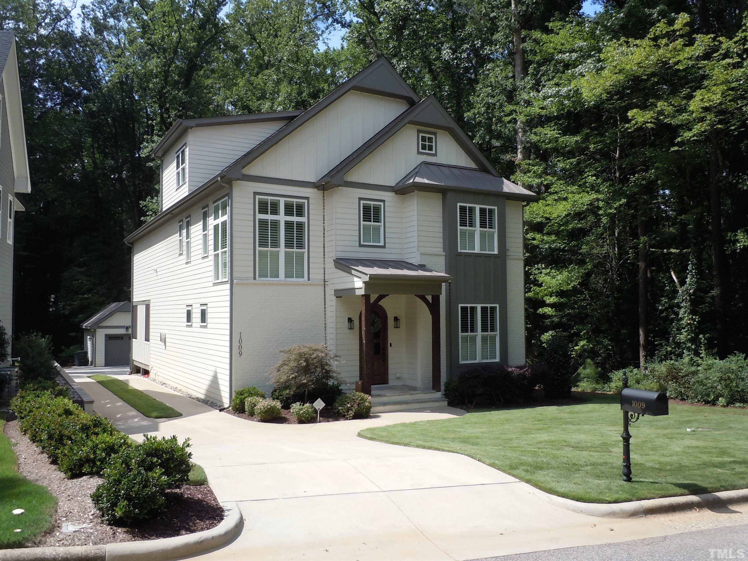 1009 Marilyn Drive Raleigh, NC 27607 - Photo 1 of 36 a front view of a house with a yard