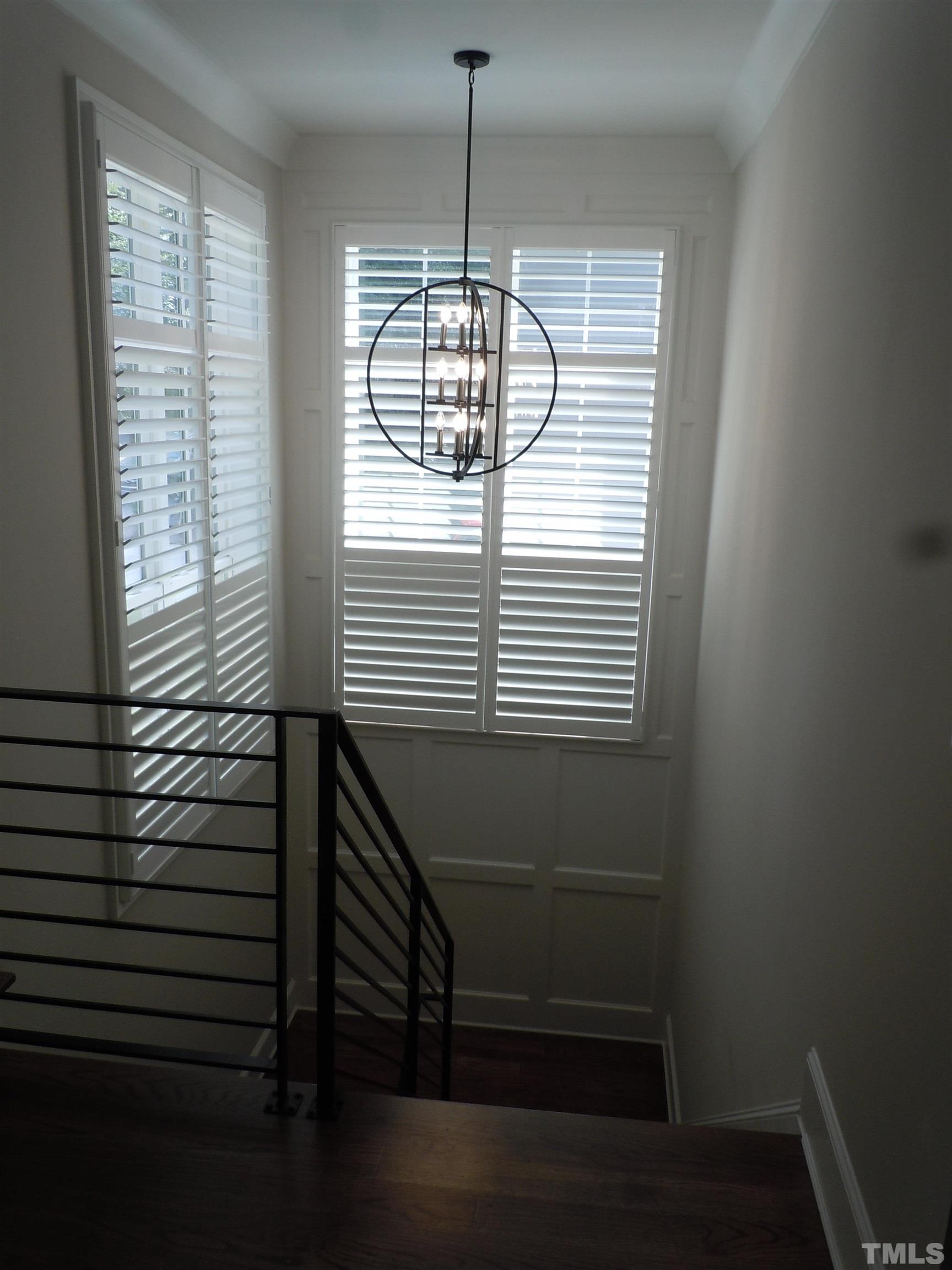 1009 Marilyn Drive Raleigh, NC 27607 - Photo 27 of 36 a view of entryway and hall with wooden floor