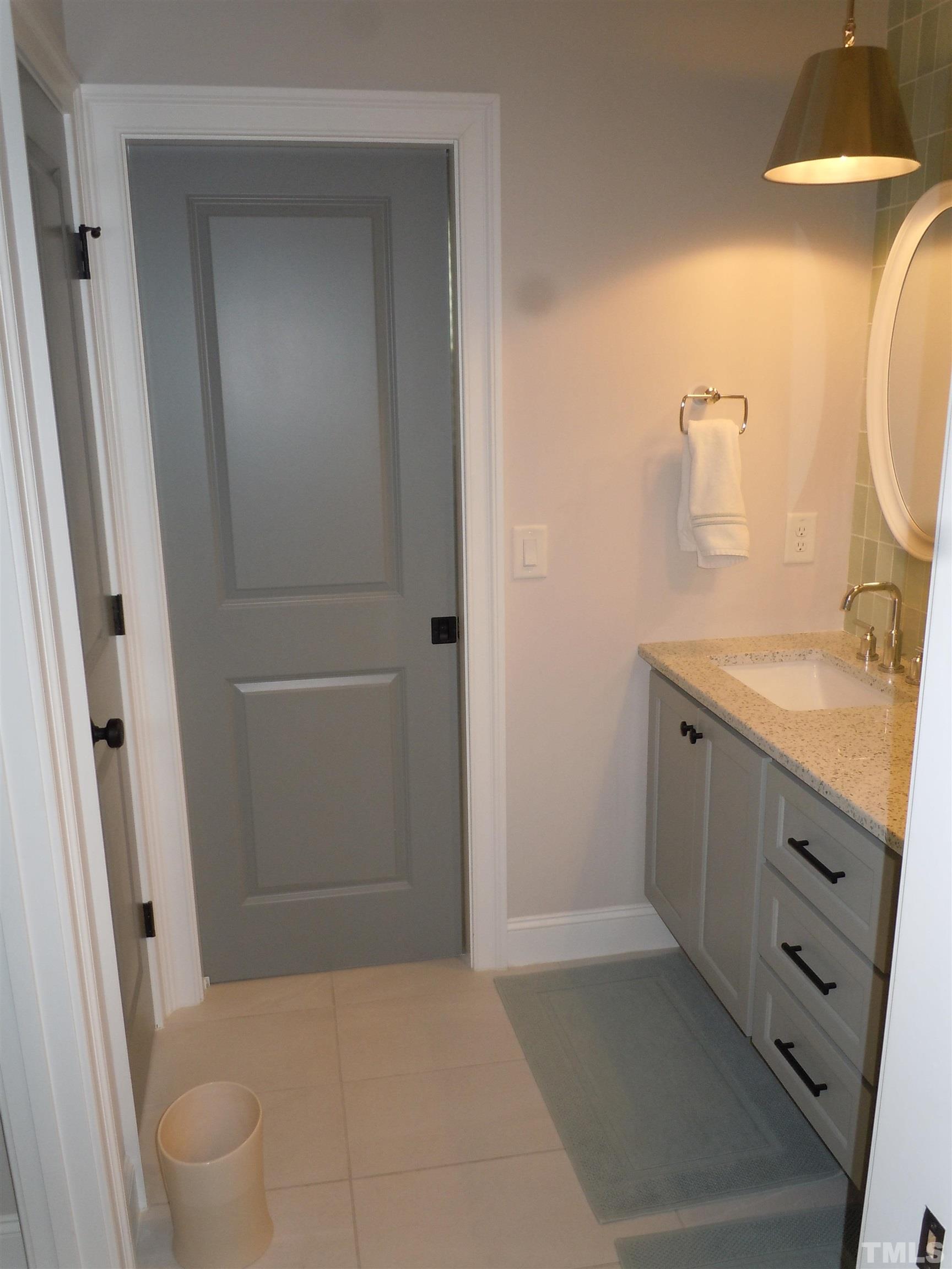 1009 Marilyn Drive Raleigh, NC 27607 - Photo 32 of 36 a bathroom with a sink a toilet and shower