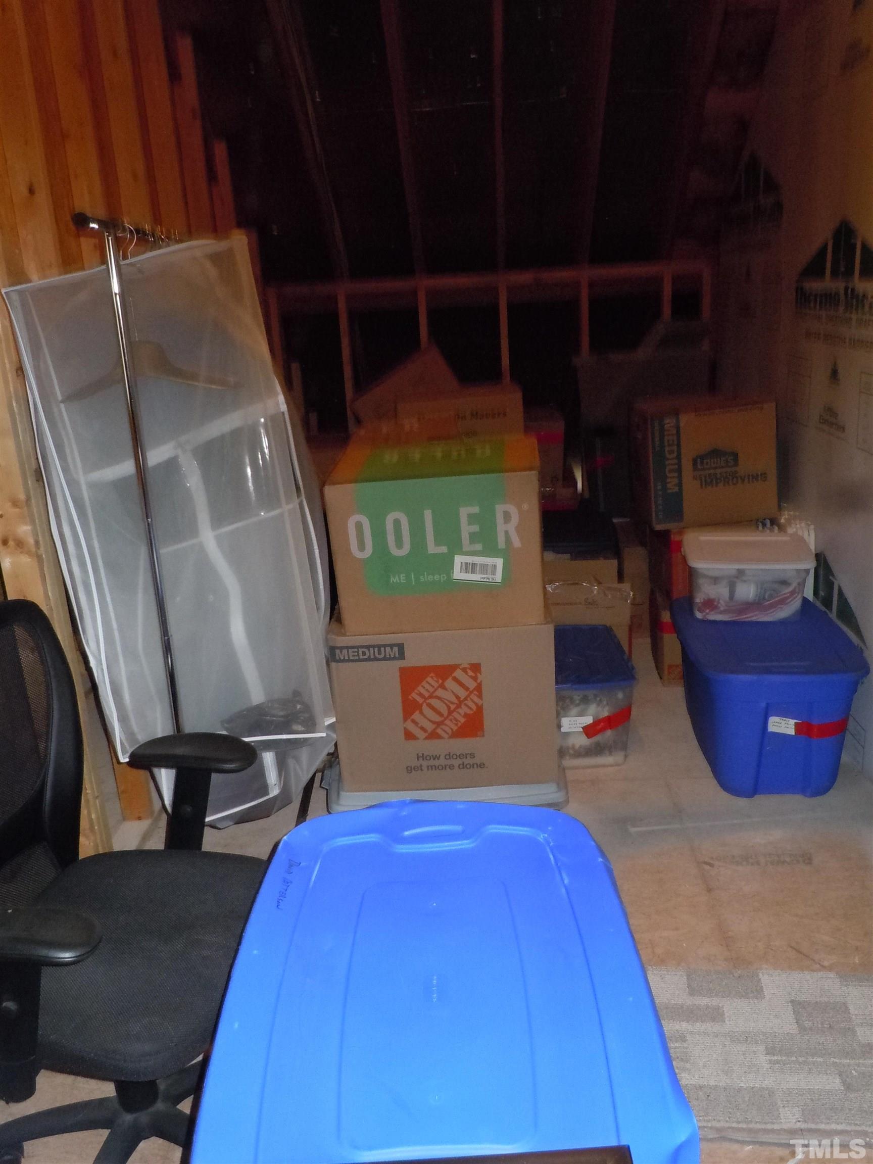 1009 Marilyn Drive Raleigh, NC 27607 - Photo 36 of 36 a room with water heater and wooden racks