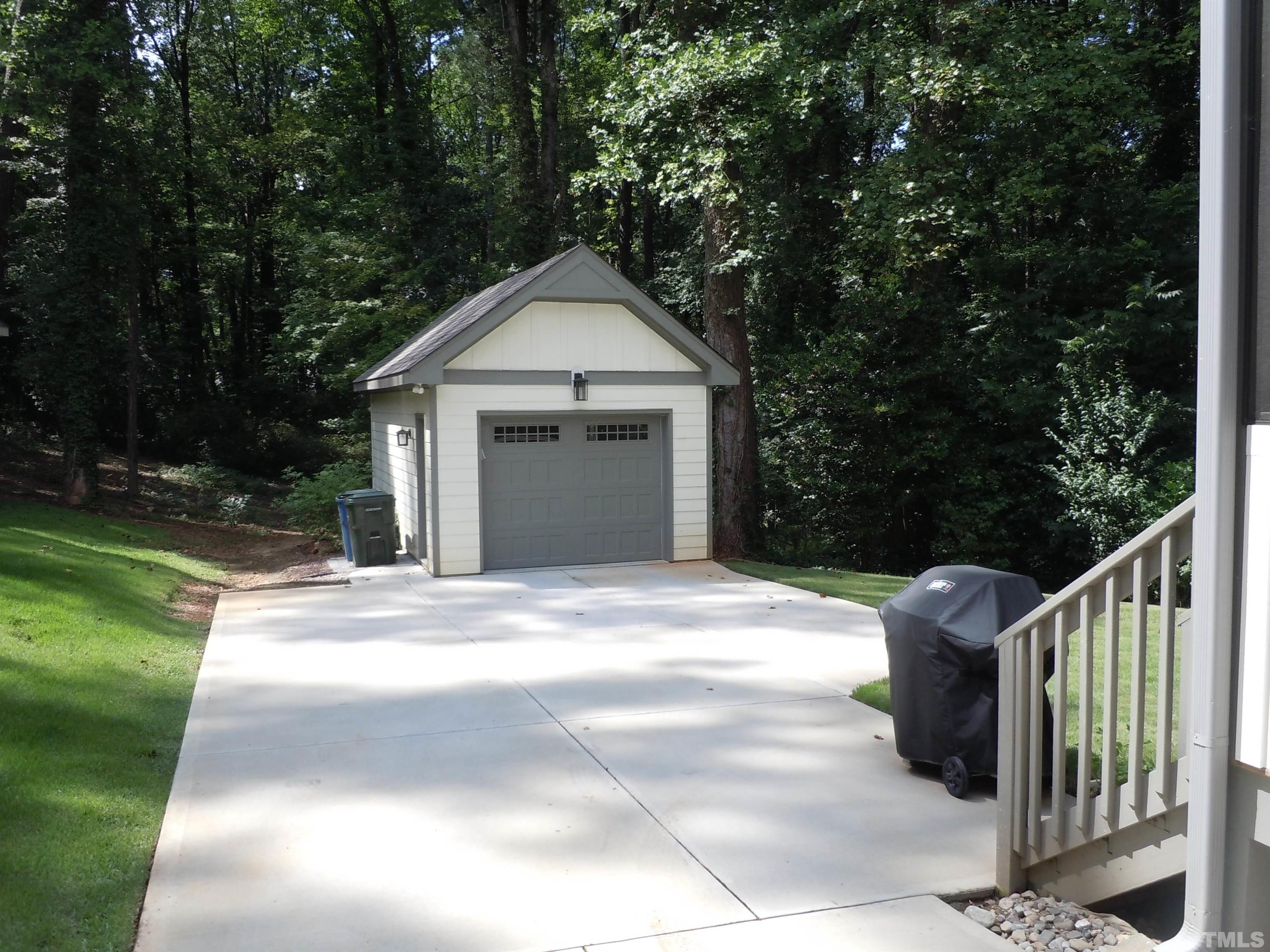 1009 Marilyn Drive Raleigh, NC 27607 - Photo 4 of 36 a front view of a house with garden