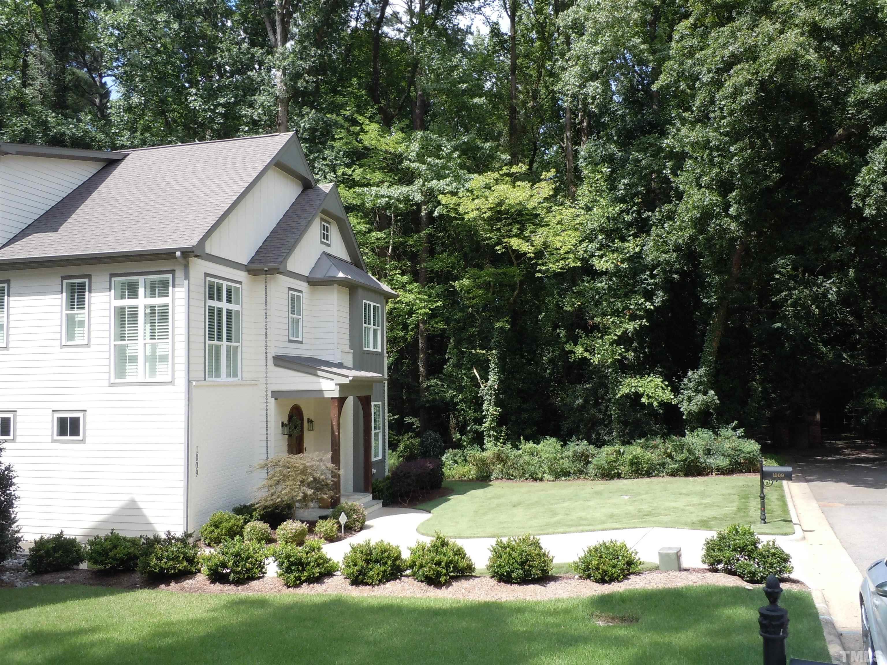 1009 Marilyn Drive Raleigh, NC 27607 - Photo 5 of 36 a front view of a house with a yard