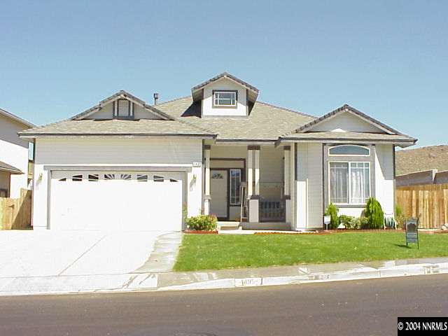 1495 Amston Road Reno, NV 89511 - Photo 1 of 1 a front view of a house with a yard and garage