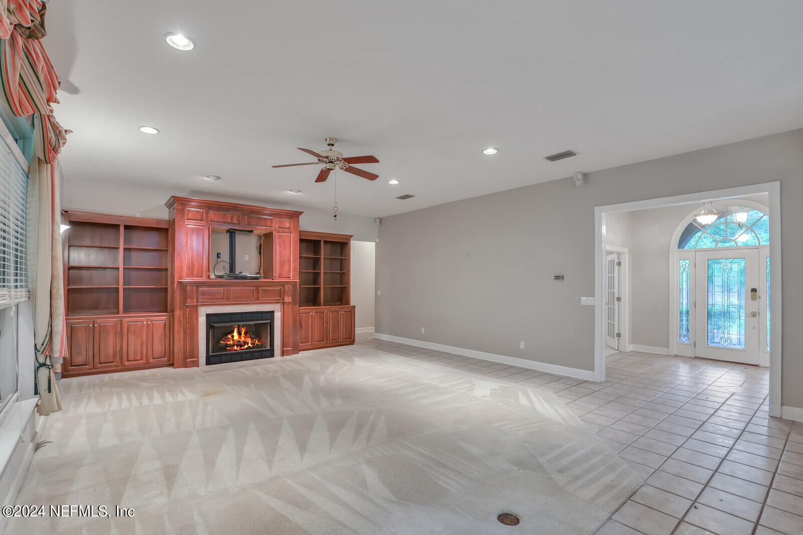 895 Roberts Road St. Johns, FL 32259 - Photo 7 of 42 an empty room with windows and fireplace