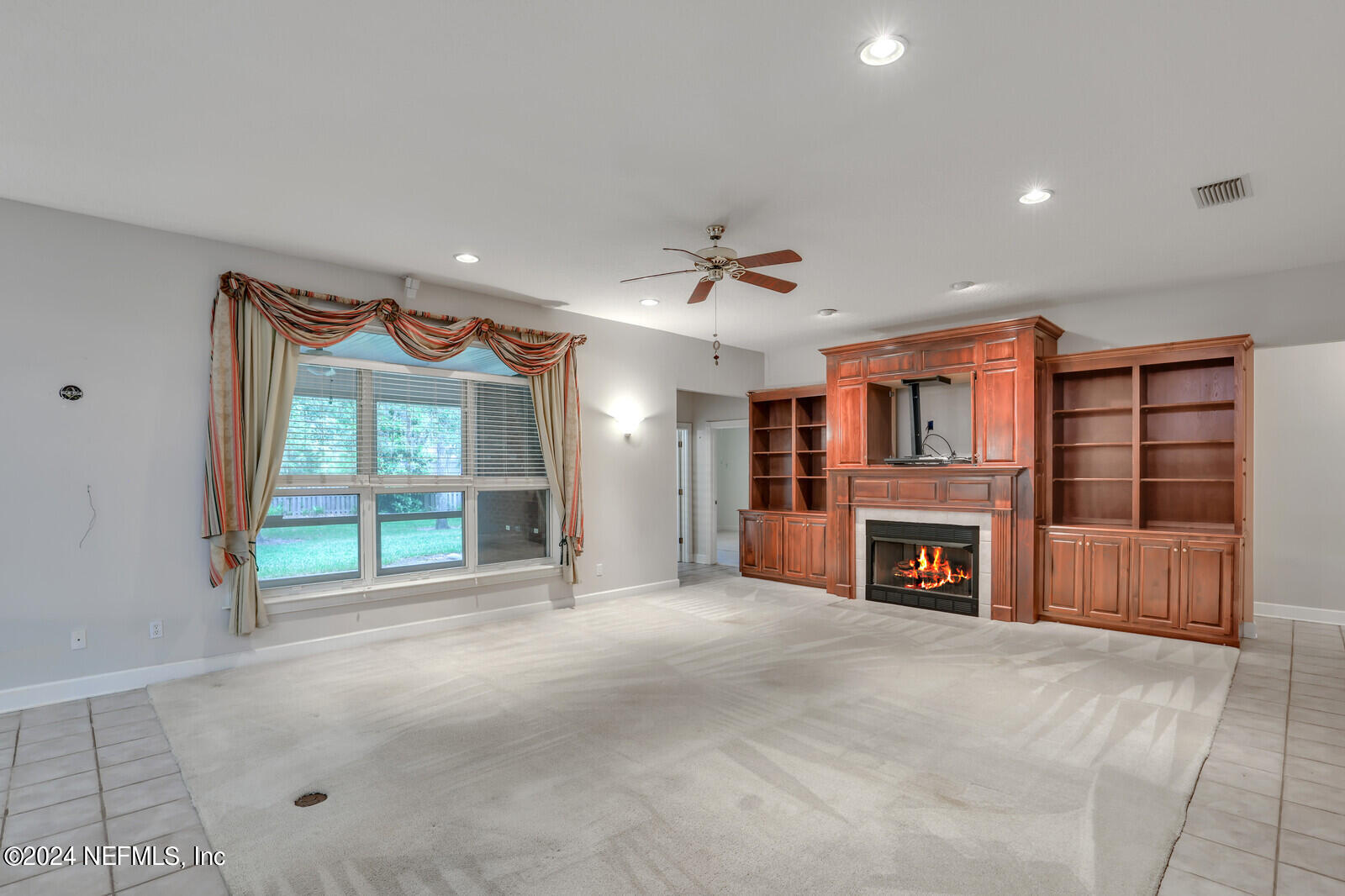 895 Roberts Road St. Johns, FL 32259 - Photo 8 of 42 a view of a livingroom with a fireplace and window